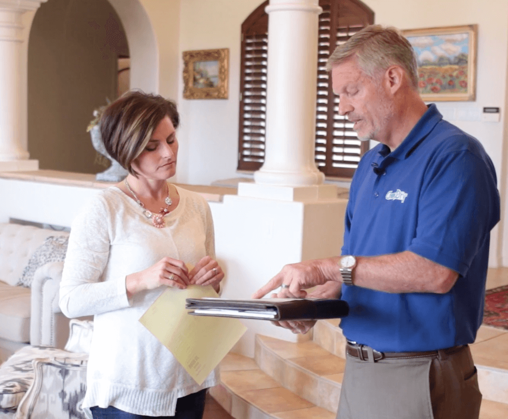 Chem-Dry tech reviewing an estimate with a customer